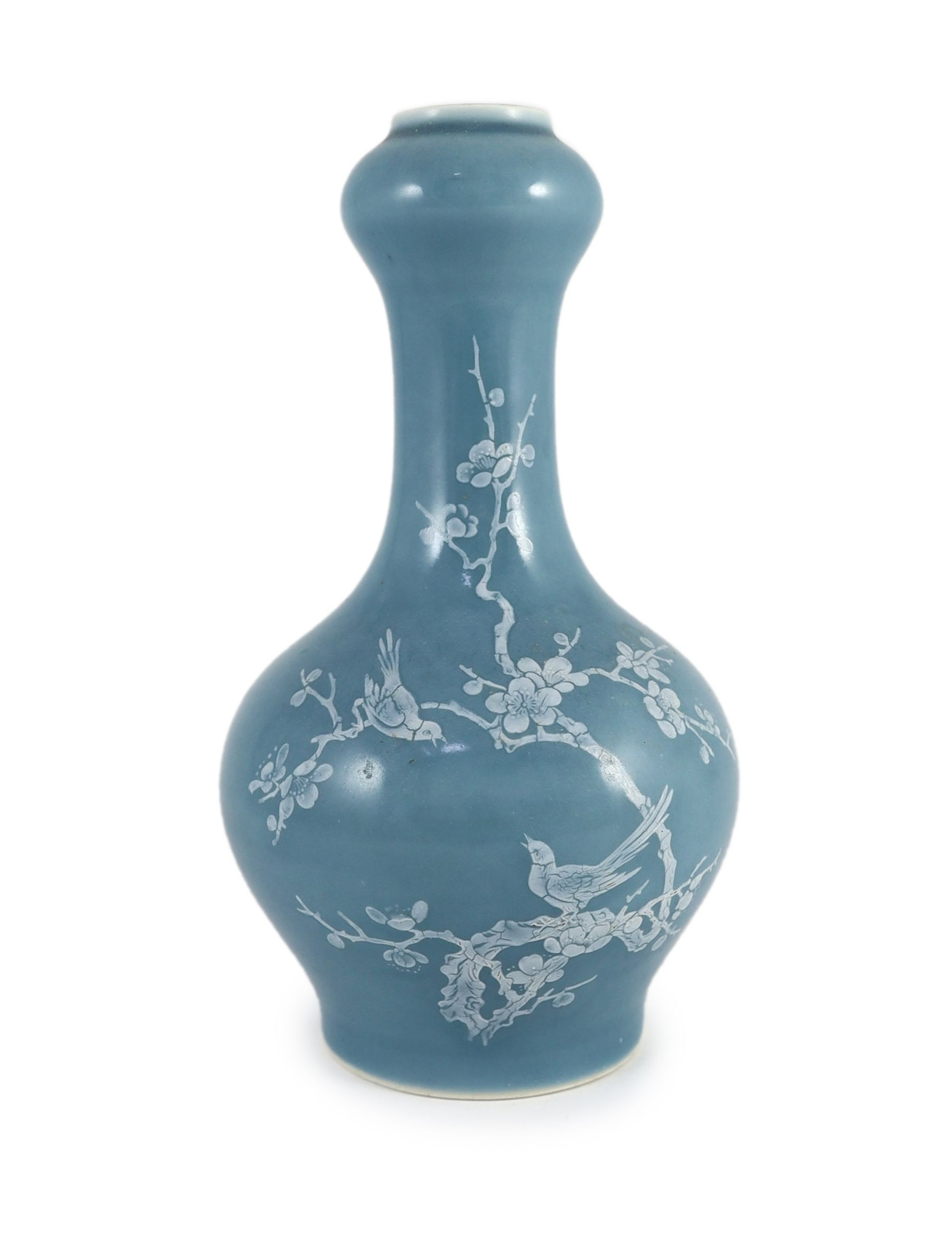 A Chinese claire de lune glazed white slip decorated vase - 25cm high